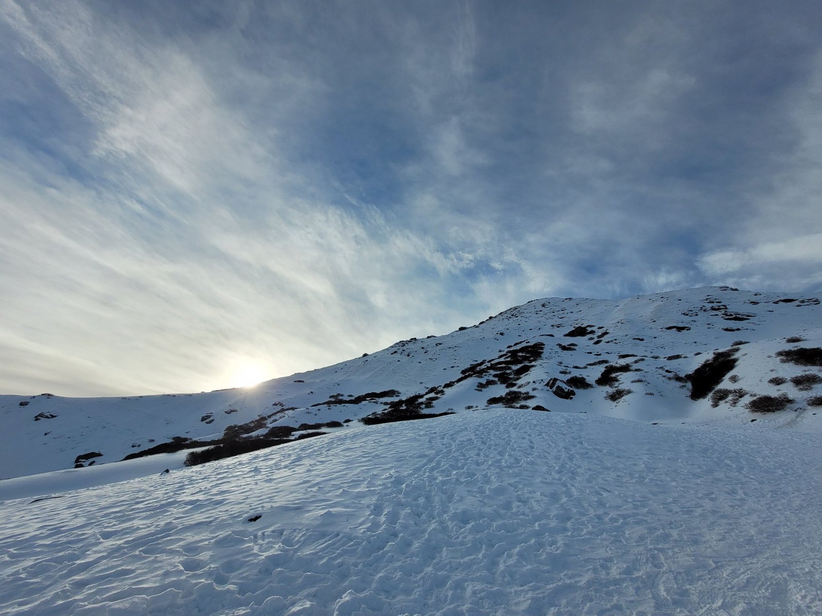 Morning light on the snow slope below Kedarkantha summit